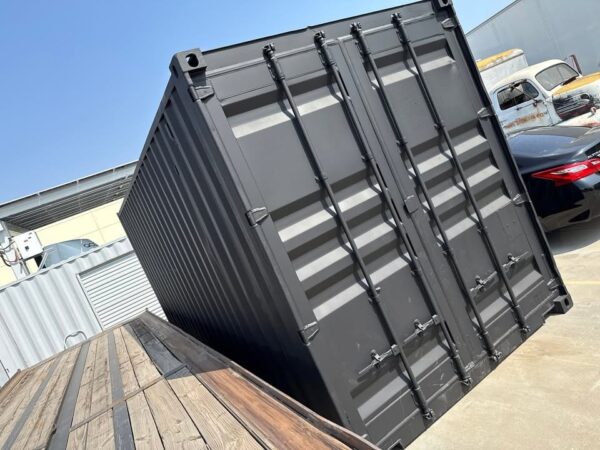 518204565_24084520587870168_1359365613162896163_n.jpg 20ft Used Shipping Container – Matte Black w/ 12’ Side Roll-Up Door