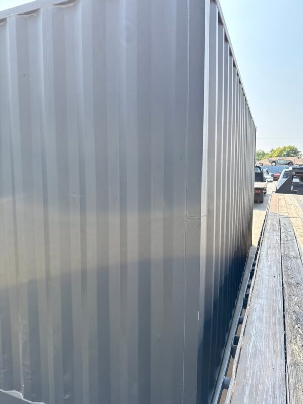 518288731_24084520584536835_7796433739846501905_n.jpg 20ft Used Shipping Container – Matte Black w/ 12’ Side Roll-Up Door