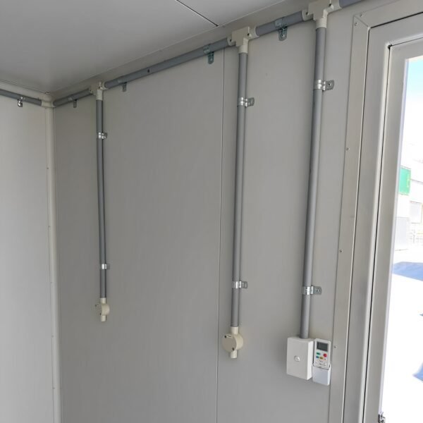 White-10′-container-modification-with-AC2-600x600-1.jpg White Modified 10ft Shipping Container with AC