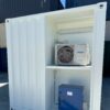 White-10′-container-modification-with-AC3.jpg White Modified 10ft Shipping Container with AC